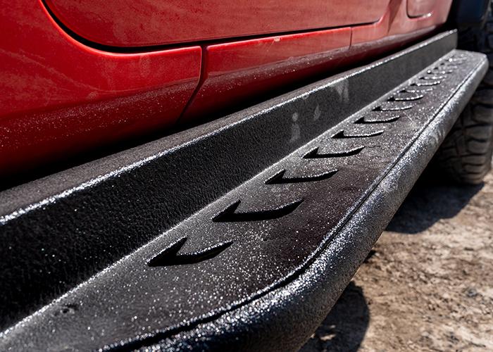 Close up of side step on red truck
