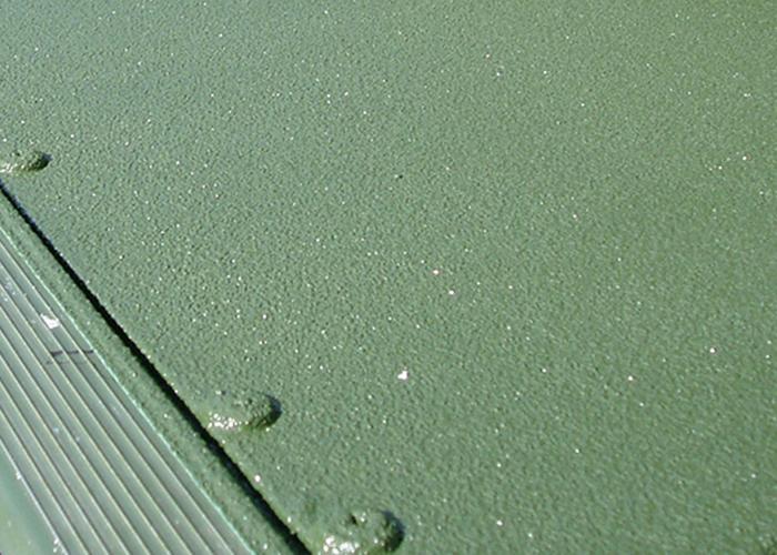 Close up of green metal polyurea coating